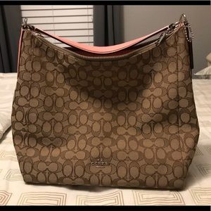 Coach purse with detachable cross-body strap